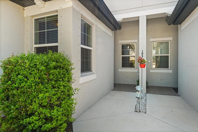 5998 Amberly Dr, Bradenton, FL 34208 - doorway to property with stucco siding