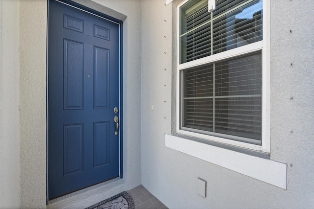 5998 Amberly Dr, Bradenton, FL 34208 - view of exterior entry featuring stucco siding