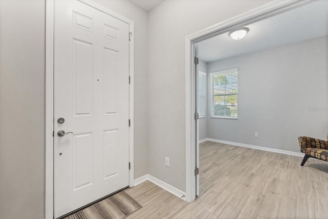 5998 Amberly Dr, Bradenton, FL 34208 - foyer with baseboards and light wood-style floors