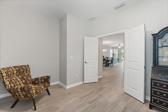 5998 Amberly Dr, Bradenton, FL 34208 - living area with visible vents, baseboards, and light wood-style flooring