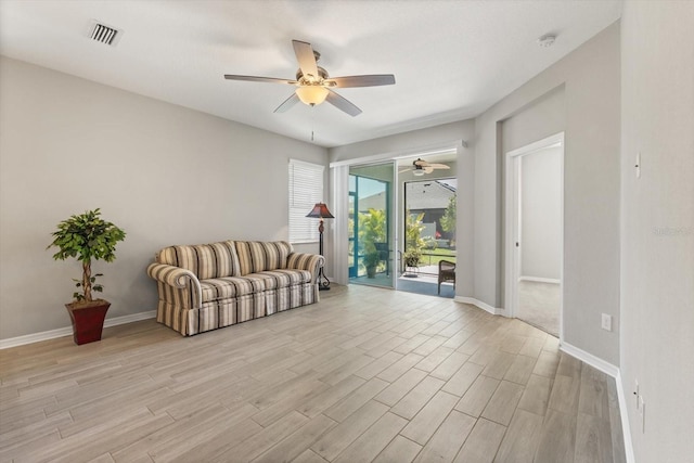 5998 Amberly Dr, Bradenton, FL 34208 - living area featuring visible vents, baseboards, light wood-style flooring, and a ceiling fan