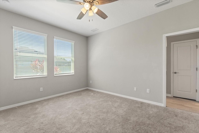 5998 Amberly Dr, Bradenton, FL 34208 - spare room with ceiling fan, baseboards, visible vents, and light carpet