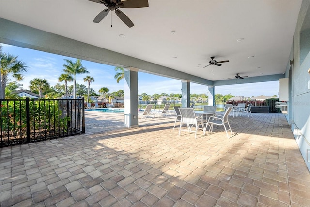 5998 Amberly Dr, Bradenton, FL 34208 - view of patio / terrace featuring a community pool, outdoor dining area, a ceiling fan, and fence
