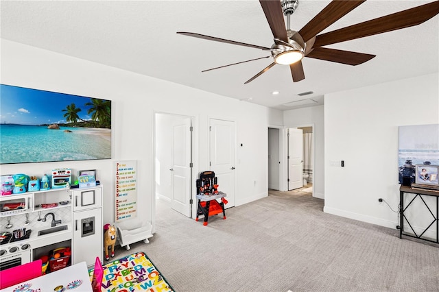 game room featuring visible vents, baseboards, carpet, and ceiling fan