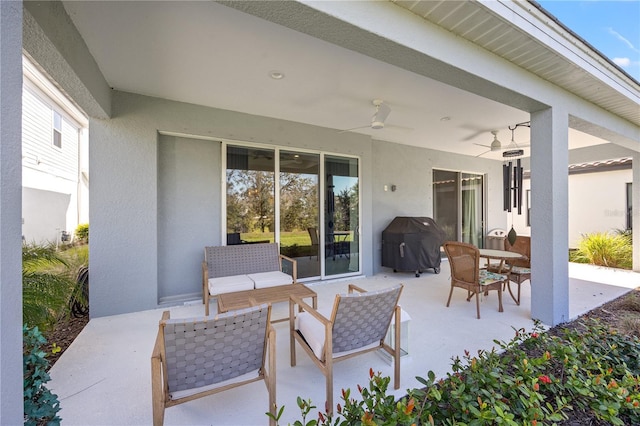 view of patio / terrace featuring outdoor dining space, a ceiling fan, and a grill