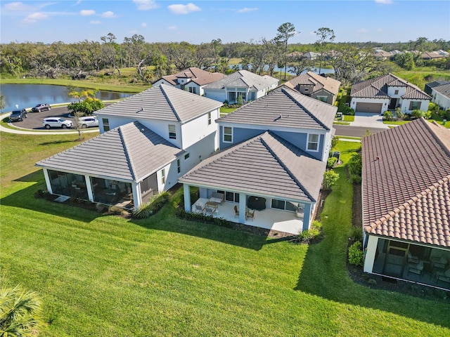 aerial view featuring a residential view and a water view