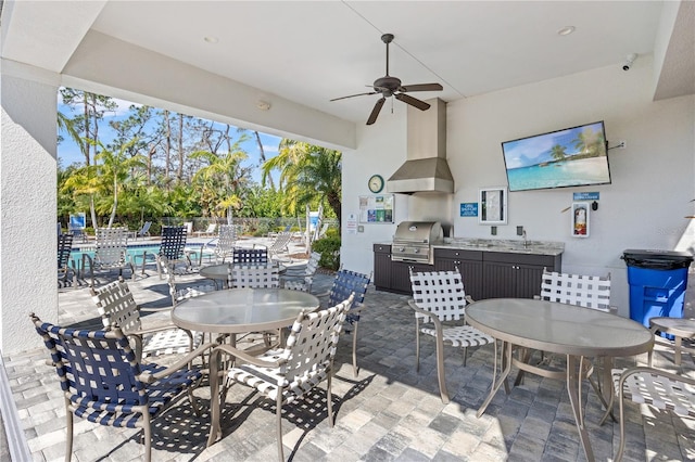 view of patio with outdoor dining space, a ceiling fan, fence, area for grilling, and a grill