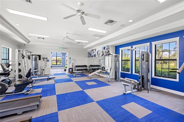 workout area with ceiling fan, visible vents, baseboards, and ornamental molding