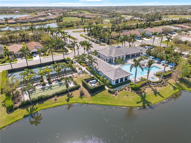 bird's eye view featuring a water view and a residential view