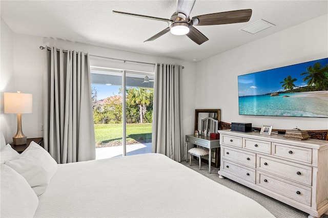 bedroom with ceiling fan, access to outside, and visible vents