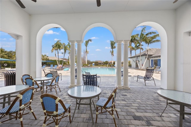 view of patio / terrace with a community pool and ceiling fan