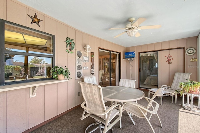 interior space featuring outdoor dining area and ceiling fan