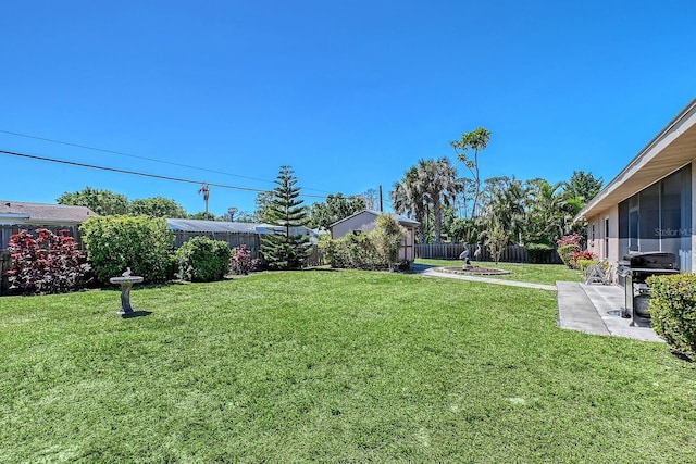 view of yard with a patio and a fenced backyard