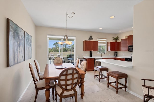 dining space featuring light tile patterned floors, a notable chandelier, recessed lighting, and baseboards