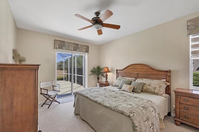 bedroom featuring light colored carpet, ceiling fan, and access to outside