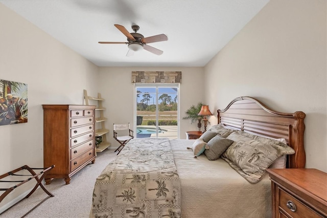 bedroom with light colored carpet, access to exterior, and a ceiling fan