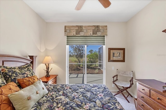 carpeted bedroom featuring ceiling fan, baseboards, and access to exterior