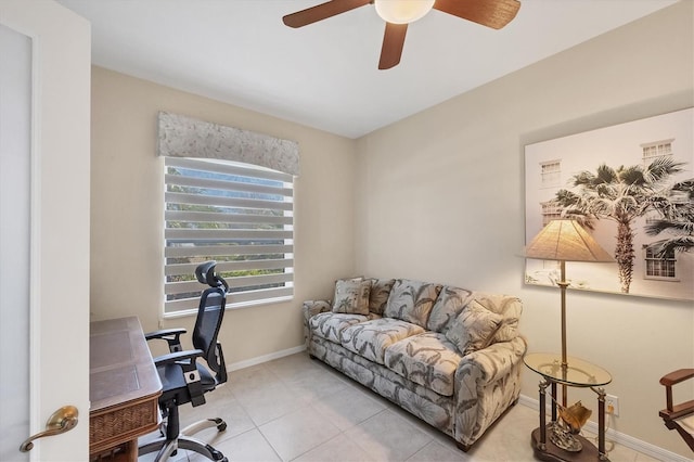 office with light tile patterned flooring, a ceiling fan, and baseboards