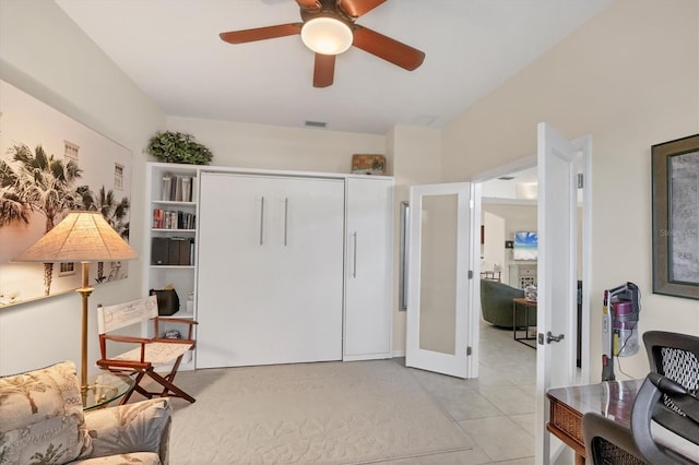 living area with light tile patterned flooring, french doors, visible vents, and ceiling fan