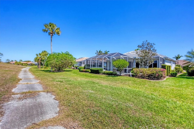 view of yard featuring a lanai