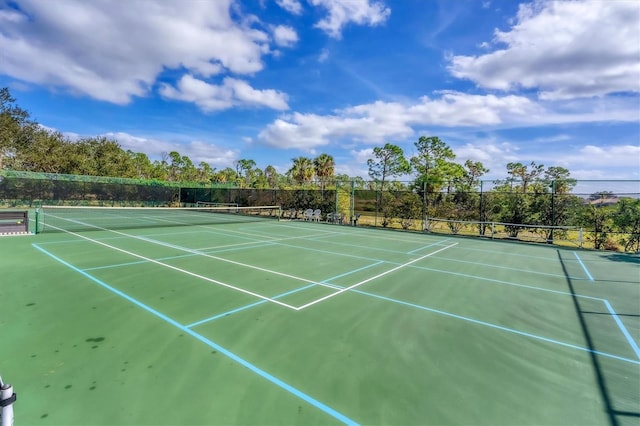 view of sport court with fence