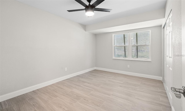 unfurnished bedroom with baseboards, ceiling fan, and light wood finished floors