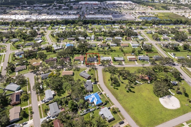 birds eye view of property with a residential view and a water view