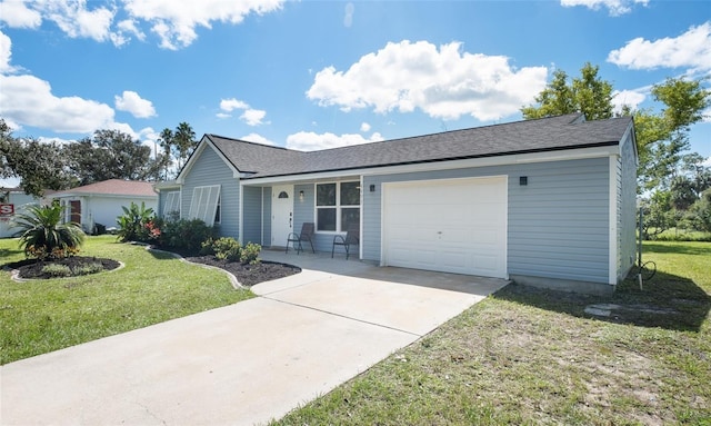 ranch-style house featuring driveway, a front yard, and an attached garage