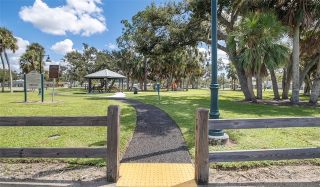 view of property's community with a gazebo and a yard