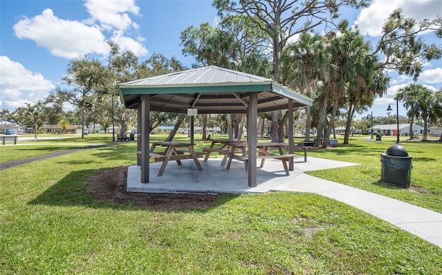 surrounding community with a gazebo and a lawn