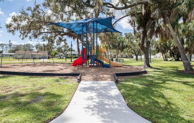 community playground featuring a lawn