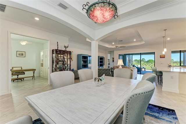 dining area with visible vents, a tray ceiling, recessed lighting, crown molding, and light tile patterned floors