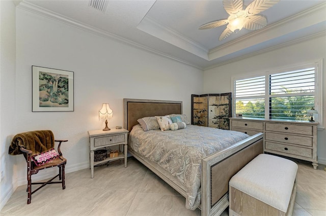 bedroom featuring baseboards, visible vents, a tray ceiling, ceiling fan, and ornamental molding