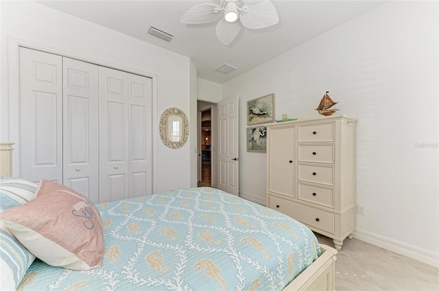 bedroom with visible vents, baseboards, a closet, and a ceiling fan