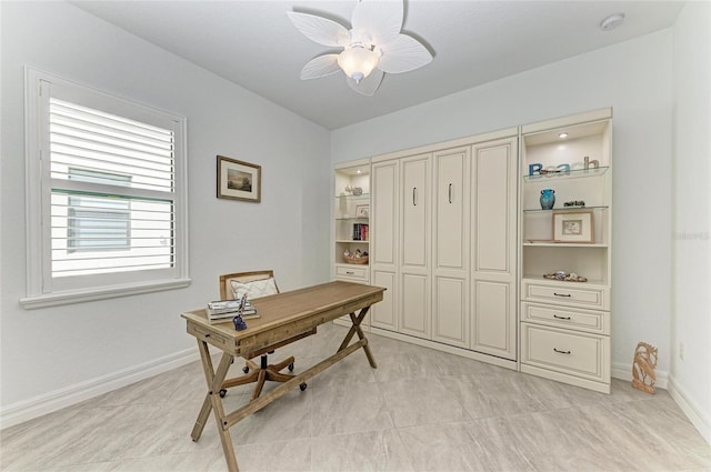 office space with light tile patterned floors, baseboards, and ceiling fan