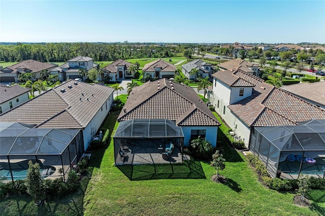 birds eye view of property with a residential view