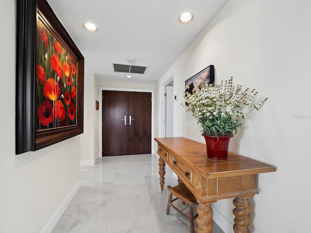 entryway featuring recessed lighting, visible vents, baseboards, and marble finish floor