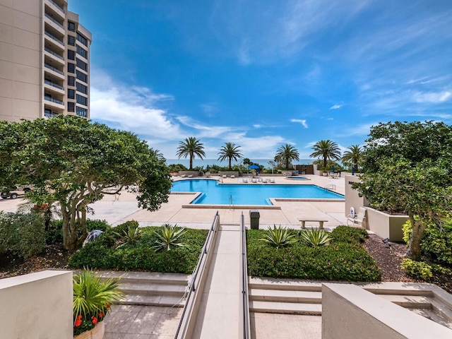 community pool with a patio area