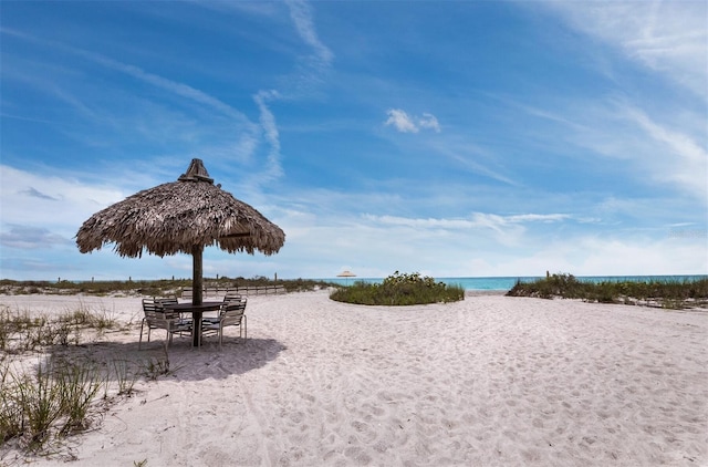 view of property's community featuring a view of the beach and a water view