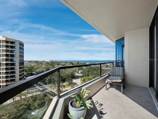 balcony featuring a water view