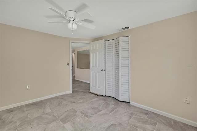 unfurnished bedroom featuring baseboards, visible vents, a closet, and a ceiling fan