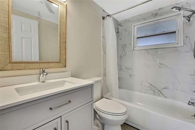 full bathroom with toilet, shower / tub combo, and vanity