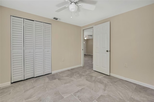 unfurnished bedroom featuring baseboards, visible vents, a closet, and a ceiling fan