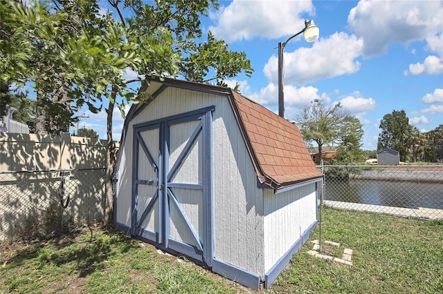 view of shed featuring a fenced backyard