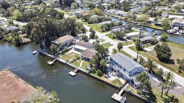 drone / aerial view featuring a water view and a residential view