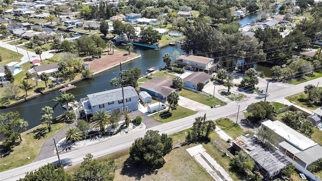 drone / aerial view with a residential view and a water view