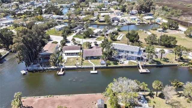 drone / aerial view with a residential view and a water view