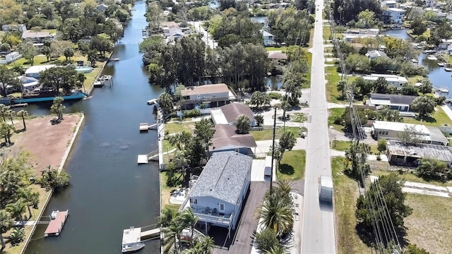 birds eye view of property with a residential view and a water view