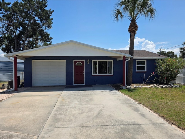 14914 Old Dixie Hwy, Hudson, FL 34667 - ranch-style home with a front lawn, driveway, and a garage