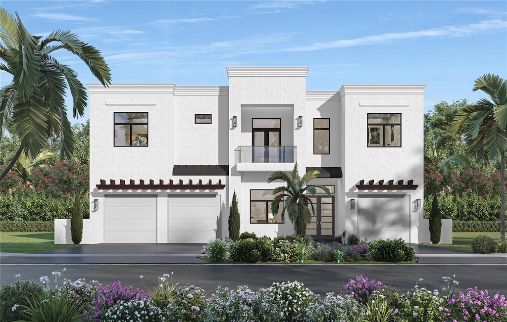 view of front of property with stucco siding, an attached garage, and a balcony